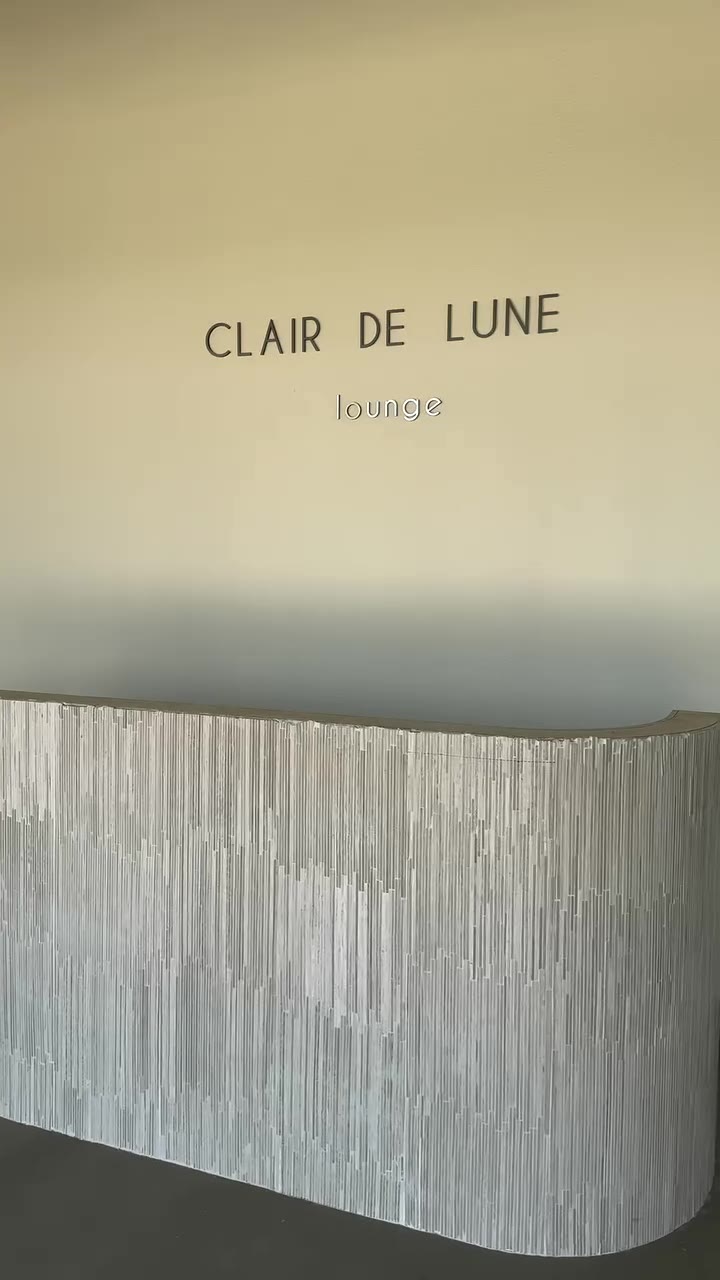 The Clair de Lune Lounge sign above the fluted reception desk